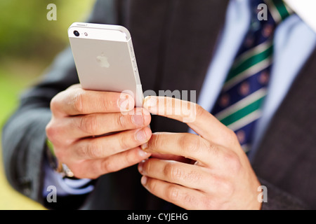 Man using iPhone 5 Stock Photo