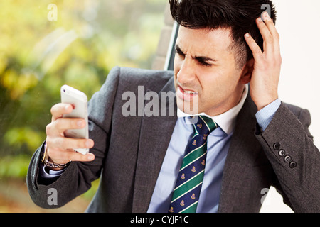 Man using iPhone 5 Stock Photo