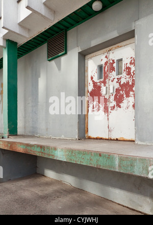 Warehouse exterior with aged doors. Stock Photo