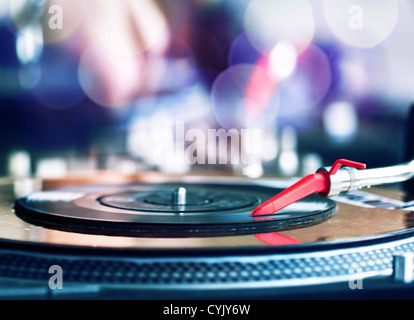 Vinyl record spinning on DJ player Stock Photo