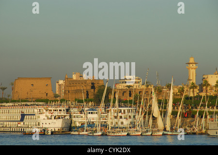 LUXOR, EGYPT. An evening view of Luxor Temple from the River Nile, with cruise boats and feluccas moored by the Corniche. 2009. Stock Photo