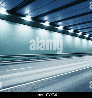 Tunnel road area with spotlights. Toned in blue. Stock Photo