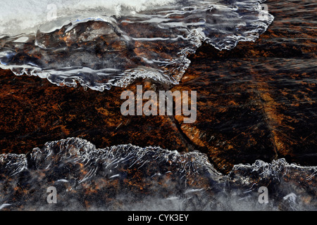 Winter stream with open water and ice formations, Greater Sudbury, Ontario, Canada Stock Photo