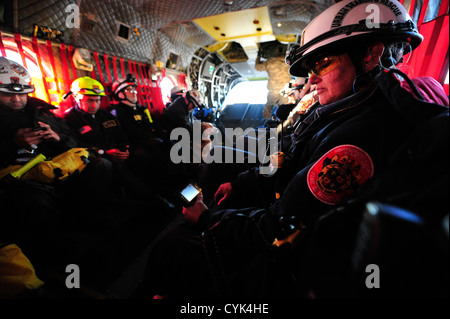 Members of Maryland Urban Search and Rescue Task Force one fly aboard a U.S. Army CH-47 helicopter assigned to the Georgia Army Stock Photo