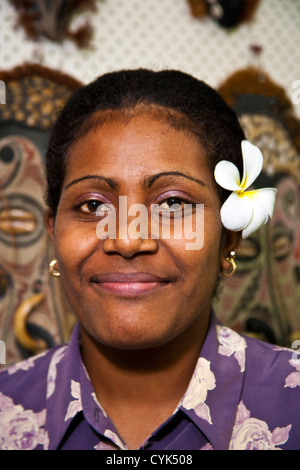 Fiji, Portrait of a smiling Fijian woman with a flower in her hair Stock Photo