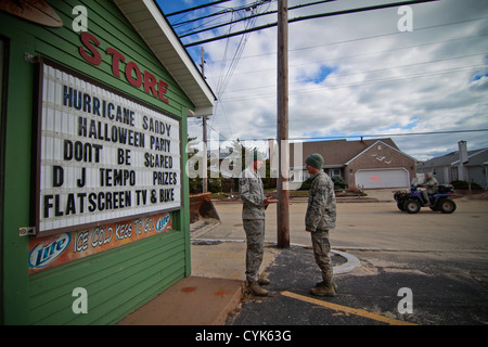 New Jersey Air National Guardsmen from the 227th Air Support Operations Squadron, 177th Fighter Wing, prepare to provide security patrols in the beach area of Brick Township, N.J. on Nov 3. New Jersey Stock Photo