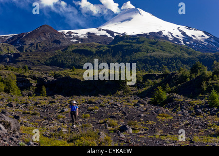 Villarrica National Park, Chile. South America. Woman hiker on active Villarrica Volcano. Sendero de las Cascadas. (MR) Stock Photo