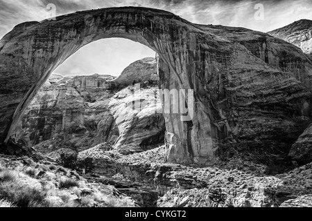 Rainbow Bridge National Monument in Lake Powell is the world's largest known natural bridge. It is located on the Navajo Reservation. Stock Photo
