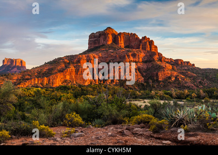 Sunset is very dramatic on the red rock hills surrounding Sedona, Arizona. Stock Photo