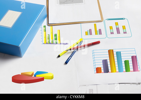 Financial. Clipboard with Papers and Pen. Graphs and Pie charts. Blue theme. Stock Photo