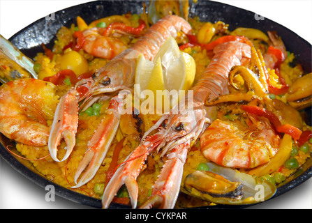 Paella with seafood in a frying pan on a white background Stock Photo