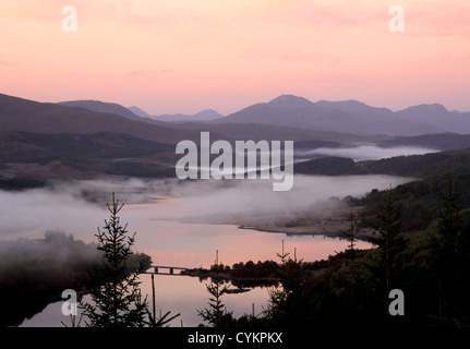UK Scotland Inverness-shire Highland Loch Garry autumn mist and kinlochhourn mountains Stock Photo