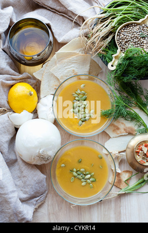 Pumpkin soup seeds onion and lemon Stock Photo