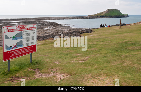 Wales, Gower Peninsula, Rhossili, Worms Head, causeway danger warning sign Stock Photo