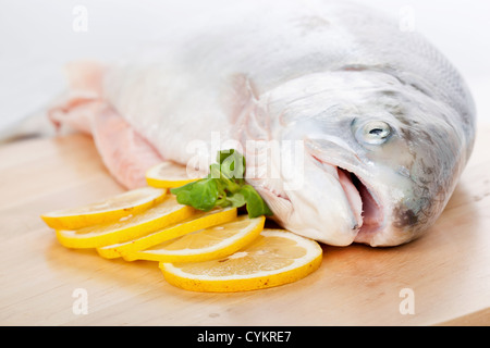 Wooden Cutting Board full of Fish Scales and Fish Fillet Preparations  cutting head of fish with Traditional Indigenous Same Knife after fishing  trip Stock Photo - Alamy