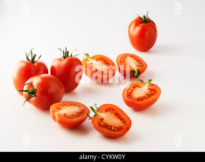Halved plum tomatoes on kitchen counter Stock Photo