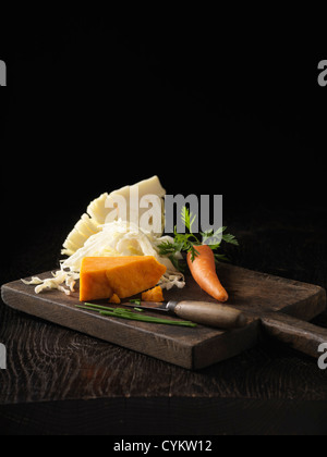 Onion, carrot and cabbage on board Stock Photo