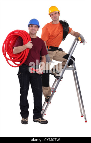 Two electricians working together Stock Photo