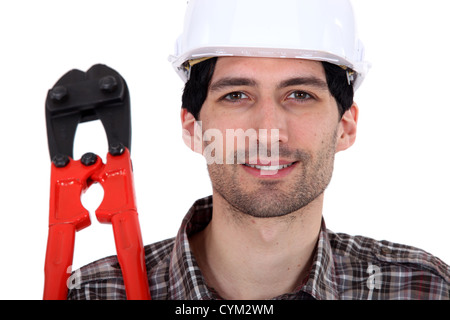 Man holding bolt cutters Stock Photo