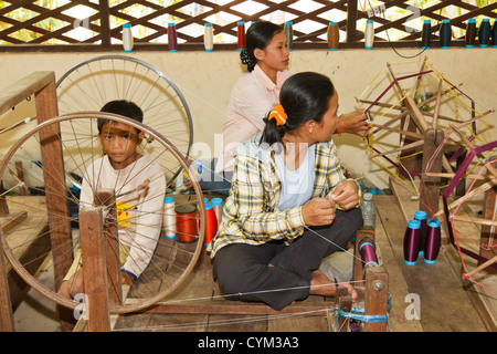 Spinning traditional Cambodian Silk at the Artisans d'Angkor near Siem Reap, Cambodia Stock Photo