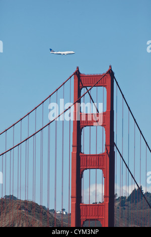 747 jumbo jet flies low over the Golden Gate Bridge and San Francisco Bay during Fleet Week on October 7, 2011 in San Francisco, Stock Photo