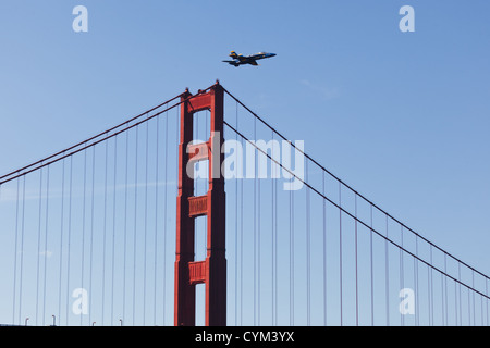 Fighter jet flies low over Golden Gate Bridge during Fleet Week Air show on October 9, 2011 in San Francisco. Stock Photo