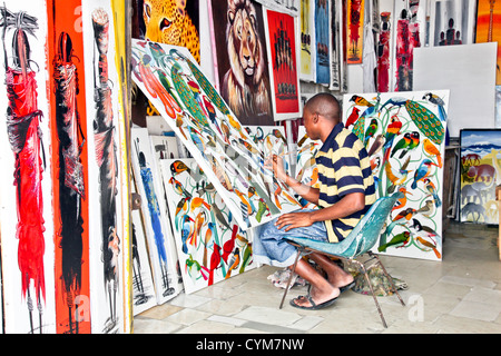 Local Artist;Painter is working in his shop in Stone Town;Zanzibar;Tanzania;East Africa;Africa; Stock Photo