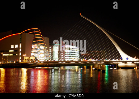 view of the samuel beckett bridge over the river liffey and the convention centre dublin at night dublin republic of ireland Stock Photo