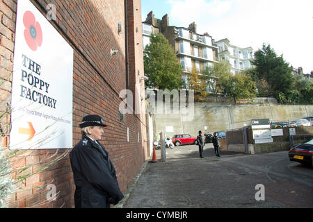 7th November 2012. London UK. Her Majesty The Queen visits the  Royal British Legion Poppy Factory to mark the 90th aniversary of the British Legion. Stock Photo