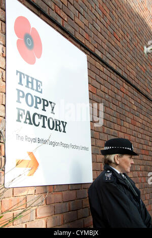 7th November 2012. London UK. Her Majesty The Queen visits the  Royal British Legion Poppy Factory to mark the 90th aniversary of the British Legion. Stock Photo