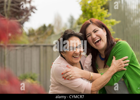 Hispanic mother and daughter hugging Stock Photo