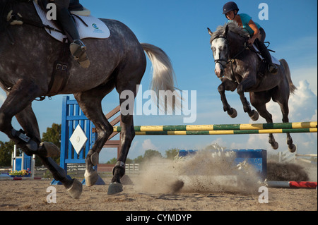 A rider gets airborne while practicing for an equestrian event.