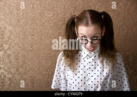 Cute Nerdy Girl Leaning Against a Wall Stock Photo