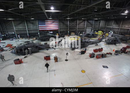 New Jersey Army National Guard maintainers with the 1-150th Assault Helicopter Battalion prepare UH-60 Black Hawk helicopters for further search and rescue missions following the passing of Hurricane Sandy Oct. 30, 2012. (U.S. Air Force photo by Master Sgt. Mark C. Olsen/Released) Stock Photo