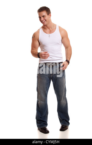 Casual young man in white undershirt and jeans. Stock Photo