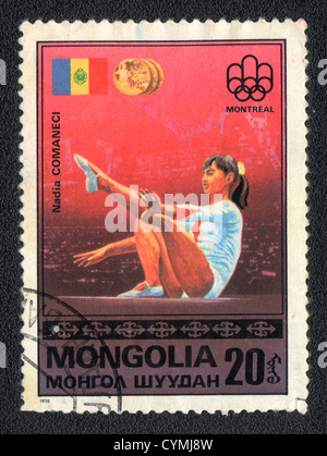Mongolia- circa1976: A stamp printed in Mongolia shows gymnast Nadia Comaneci, circa 1976 Stock Photo