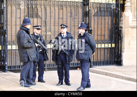 Armed police officers outside the Houses of Parliament in London, as ...