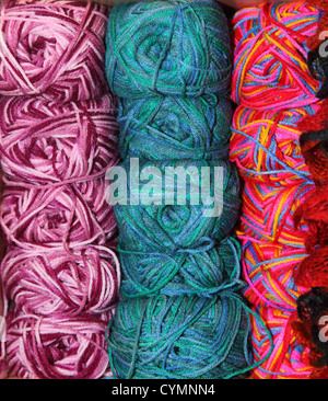 Merino wool colorful dyed textile long hanging strands Stock Photo