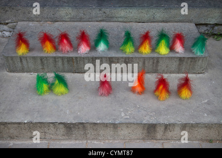 A row of coloured jianzi shuttlecocks on display during morning exercises in Beihai Park, Beijing, China Stock Photo