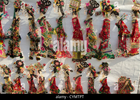 Wooden and paper souvenir figures on sale at a shop in a street in Liulichang, Beijing China. Stock Photo