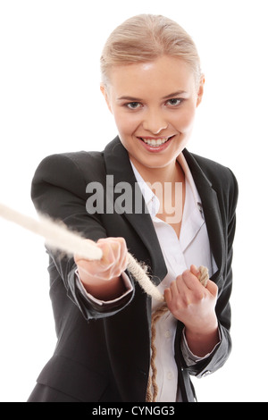 Businesswoman pulling on a piece of rope Stock Photo