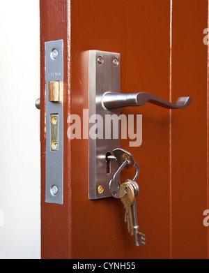 Lock and keys. Closeup of opened metal padlock with key inside isolated on  a white background. Macro photograph of metal lock with keys Stock Photo -  Alamy