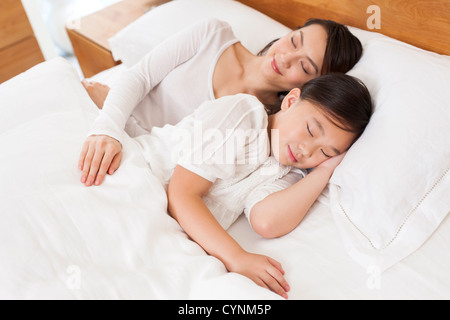 Mother and daughter in deep sleep Stock Photo