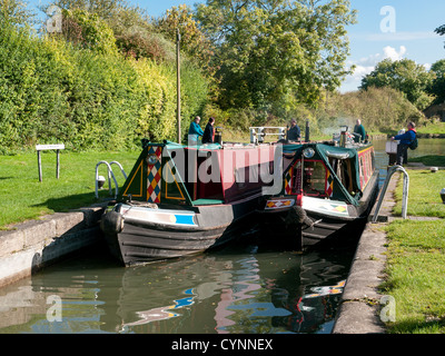 Two narrow boats in a lock on the Grand Union Canal at Marsworth, Buckinghamshire, UK Stock Photo