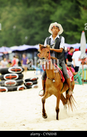 horse riding at Cha Am beach , Cha Am, Thailand Stock Photo