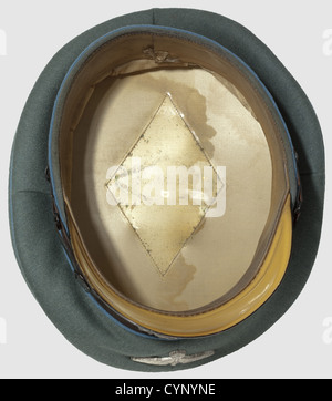 A visor cap for enlisted men/junior officers, of the Secret Field Police. Fine, field grey cloth with dark brown cap band, light blue piping and silvered metal insignia, silk liner with gold-stamped label 'Sonderklasse' and leather sweat band, historic, historical, 1930s, 1930s, 20th century, military police, field gendarmerie, police, gendarmerie, gendarmery, object, objects, stills, clipping, cut out, cut-out, cut-outs, NS, National Socialism, Nazism, Third Reich, German Reich, Germany, uniform, uniforms, clothes, Additional-Rights-Clearences-Not Available Stock Photo