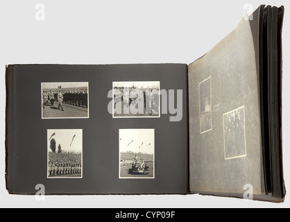A photo album of the Reich Party Day Nuremberg 1936,Brown board binding(dented)with ca. 140 photos: roll call of political leaders,SS encampment,Himmler at a 'Führerdegen' presentation ceremony,Hitler Youth roll call,HJ encampment police,Hitler inspects the formations,round trip in open car,marching through massed formations to the speaking platform accompanied by Grimminger with the 'Blutfahne',the address,consecration of colours with the 'Blutfahne',trip through town to the castle,etc. including close-ups of the various formations,their flag be,Additional-Rights-Clearences-Not Available Stock Photo