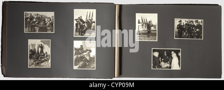 A photo album of the Reich Party Day Nuremberg 1936,Brown board binding(dented)with ca. 140 photos: roll call of political leaders,SS encampment,Himmler at a 'Führerdegen' presentation ceremony,Hitler Youth roll call,HJ encampment police,Hitler inspects the formations,round trip in open car,marching through massed formations to the speaking platform accompanied by Grimminger with the 'Blutfahne',the address,consecration of colours with the 'Blutfahne',trip through town to the castle,etc. including close-ups of the various formations,their flag be,Additional-Rights-Clearences-Not Available Stock Photo