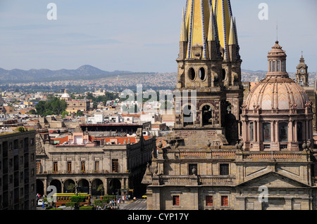 Mexico, Jalisco State, Guadalajara, View of Cathedral dome and twin spires with city to the north and Plaza Guadalajara below. Stock Photo