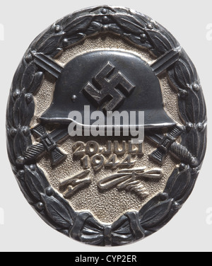 Wound Badge '20 July 1944' in Black,Silver,partially patinated and polished.Marked 'L/12' for Juncker and '800' on the reverse side.The patina is somewhat worn off,otherwise in outstanding condition.Dimensions 44.54 x 37.18 mm.Weight 39.77 grams(Nie 7.04.16).Extremely rare.Only 23 or 24 have been awarded in the three levels,gold,silver,and black.Two of which are confirmed of silver level to Staff Lt.Col.Heinrich Borgmann,Adjutant of the Wehrmacht,and to SS-Gruppenführer and General of the Waffen-SS Hermann Fegelein.A Wound Badge in Black was ,Additional-Rights-Clearences-Not Available